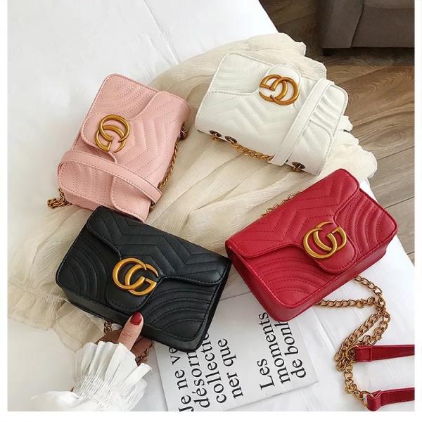 pink quilted shoulder crossbody bag with a gold tone chain strap and gold tone double G style hardware